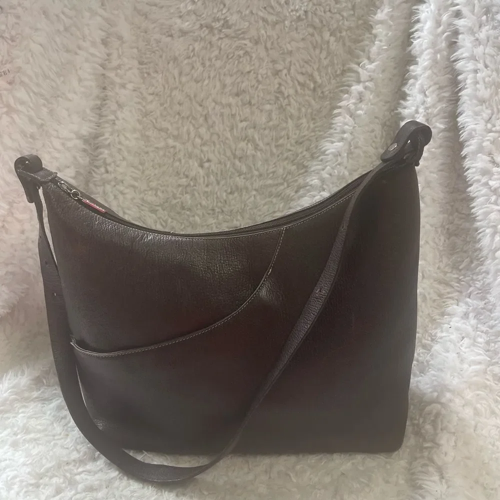 Maxx New York Leather Brown medium shoulder bag with silver tone hardwares.